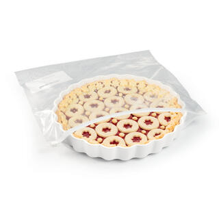 Tarte in transparenter Verpackung mit fruchtiger Füllung.