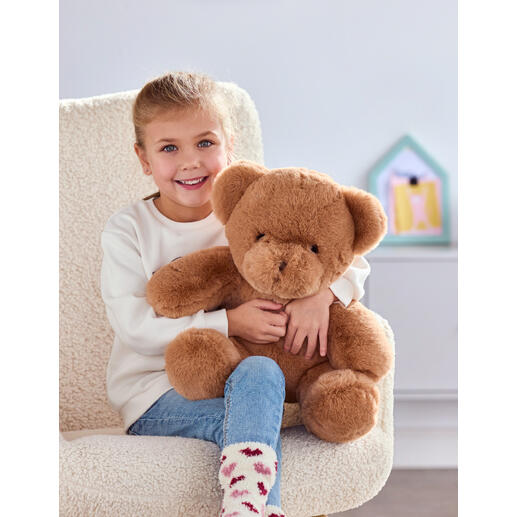 Mädchen mit braunem Teddybär, der eine persönliche Sprachnachricht abspielen kann.