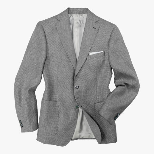 Das Sakko für warme Tage: Tausende luftiger Poren wirken wie eine eingewebte Klimaanlage. Aus italienischem Panama-Tuch konfektioniert von Sakko-Spezialist Carl Gross, seit 1925. Carl Gross Panama-Sakko in Grau mit grauem Innenfutter, lässig drapiert.