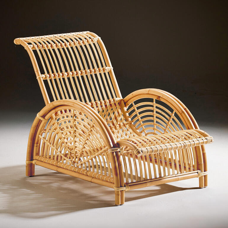 Naturfarbener Rattan-Sessel im Seitenansicht