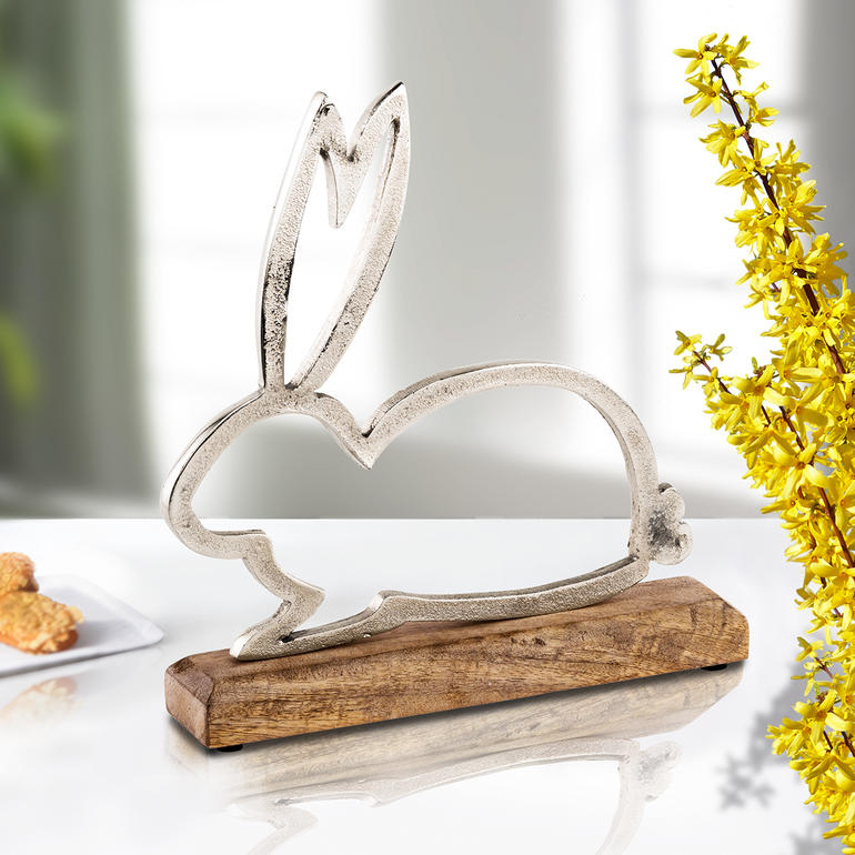 Dekorative Hasensilhouette aus Metall auf einem Holzsockel