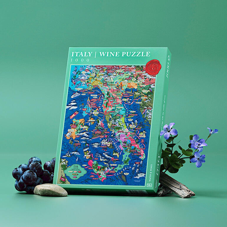 Verpackung des Wein-Puzzles mit Italienkarte und Trauben auf grünem Hintergrund.