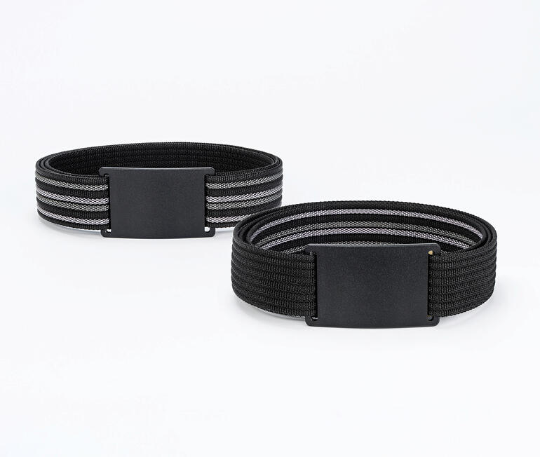 Zwei cleverbelt Vario-Wendegürtel in Schwarz und Grau auf einem Tisch.