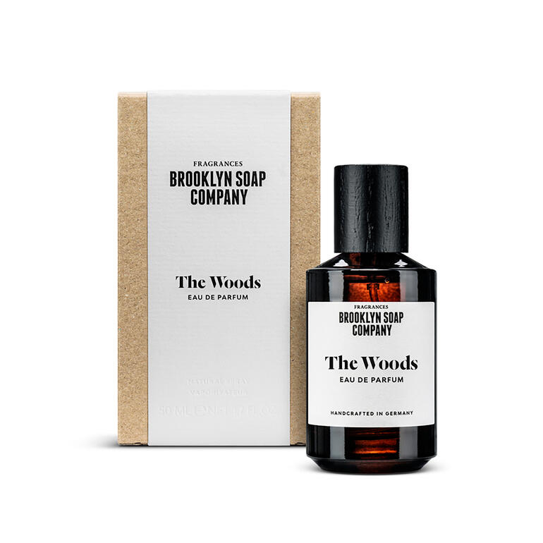 The Woods Eau de Parfum, 50 ml Flasche des Dufts 'The Woods' mit edler Verpackung.