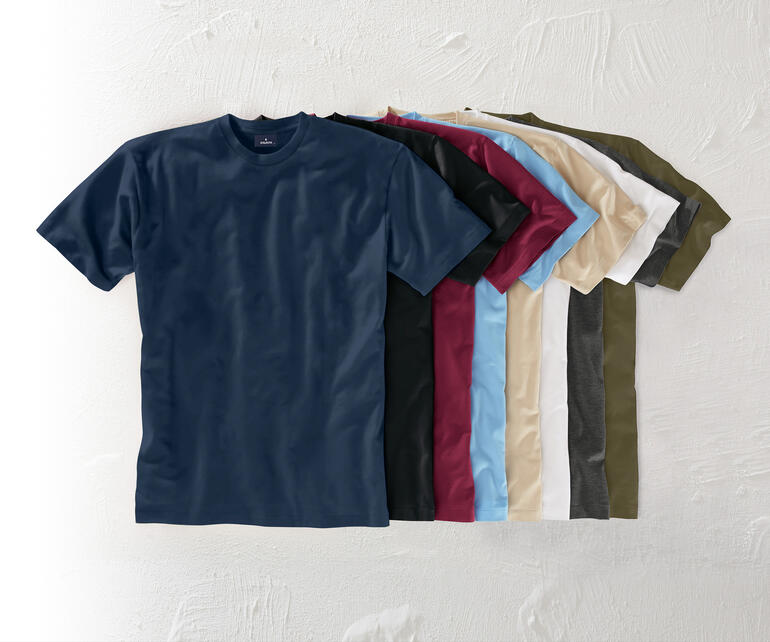 Das 155 g-Ragman T-Shirt - Ihr wichtigstes T-Shirt: Südamerikanische Baumwolle. 155 g/qm. Das seltene von Ragman. Verschiedene Farben von Das 155 g-Ragman T-Shirt auf einem Tisch.